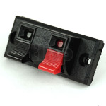 2-pole clamp terminal block, surface mounting, black plastic, red/black markers, 54x24 mm rectangular front, fixing by screws on two points (diameter 4 mm)